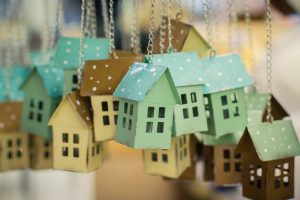 Colourful toy houses ornaments hanging on chains